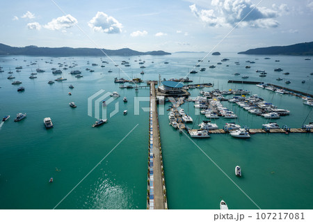 Aerial View Drone shot of Yacht and sailboat parking in marina, Transportation and travel background, Beautiful sea in summer season 107217081