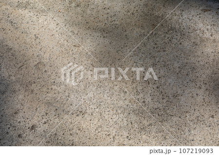 grunge outdoor polished concrete texture. Stained concrete texture. natural texture of cement. concrete in the sunshine 107219093