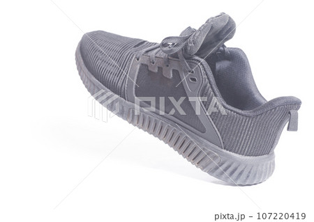Running black men's sneakers isolated on white background. Running black men's sneakers isolated on white background. 107220419