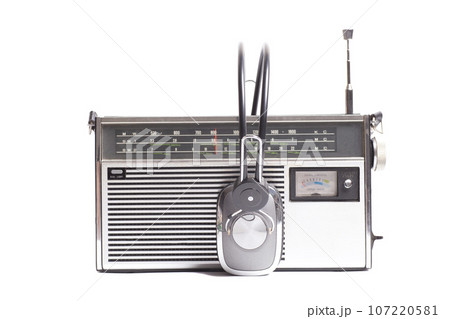 Vintage transistor radio with headphones 107220581