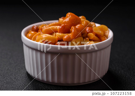 Delicious pickled honey mushrooms with salt and spices in a ceramic plate Delicious pickled honey mushrooms with salt and spices in a ceramic plate 107223158