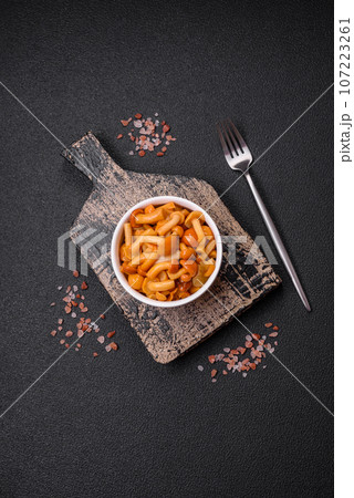 Delicious pickled honey mushrooms with salt and spices 107223261
