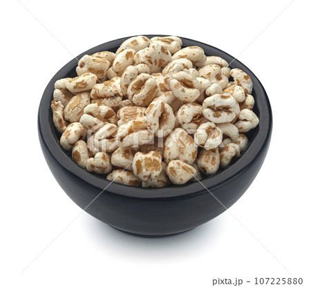 Puffed wheat isolated on white background Puffed wheat isolated on white background 107225880