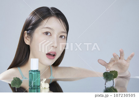 beauty concept photo of korean asain beautiful woman with mirror and cosmetic 107230505