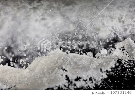 Tapioca starch flour sugar fly explosion, White powder tapioca starch sugar fall down in air. Seasoning flour powder is element material. Black background Isolated series two of images 107231246