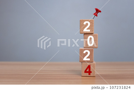 Wooden blocks lined up with the letters 2024. Represents the goal setting for 2024, the concept of a start. financial planning development strategy business goal setting 107231824