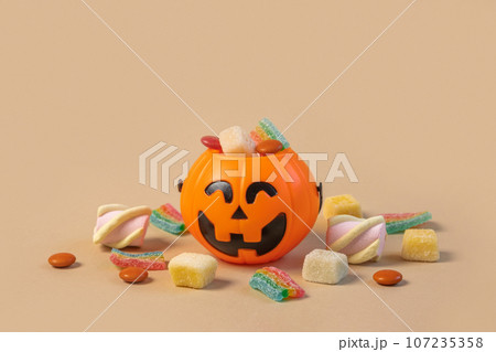 Halloween Jelly Beans. Happy Halloween Party Border Beige Background. Aesthetic Accessories Banner. Spooky Orange Pumpkin Candy Bucket. Modern Holiday Design. Thanksgiving Trendy Fall Poster Halloween Jelly Beans. Happy Halloween Party Border Beige Background. Aesthetic Accessories Banner. Spooky Orange Pumpkin Candy Bucket. Modern Holiday Design. Thanksgiving Trendy Fall Poster 107235358