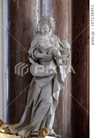 Saint Anne statue on the main altar in Amorbach Benedictine monastery church in Lower Franconia, Bavaria, Germany 107236951