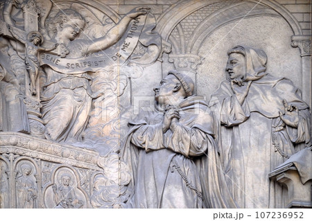 Relief on the portal of Saint Thomas Aquinas in Paris, France Relief on the portal of Saint Thomas Aquinas in Paris, France 107236952