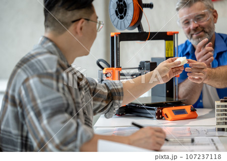 Architects making house model using 3D printer, FDM technology for architectural use. Architects making house model using 3D printer, FDM technology for architectural use. 107237118