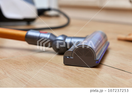 close-up, cordless vacuum cleaner on the floor. close-up, cordless vacuum cleaner on the floor. 107237253