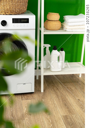 Laundry basket on washing machine in a laundry room 107238265