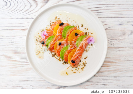 Salmon ceviche with avocado, orange and mango salsa Salmon ceviche with avocado, orange and mango salsa 107238638