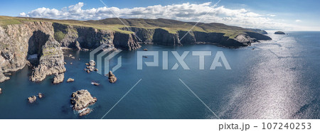 Aerial view of the cliffs near the lighthouse on the island of Arranmore in County Donegal, Ireland 107240253