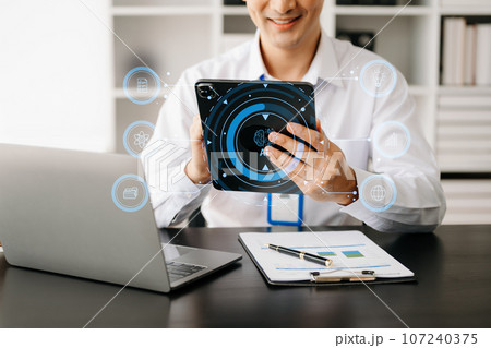 Cyber security and data protection. Business using computer and tablet protecting business and financial data with virtual from cyber attack, cybersecurity technology in modern office.. Cyber security and data protection. Business using computer and tablet protecting business and financial data with virtual from cyber attack, cybersecurity technology in modern office.. 107240375
