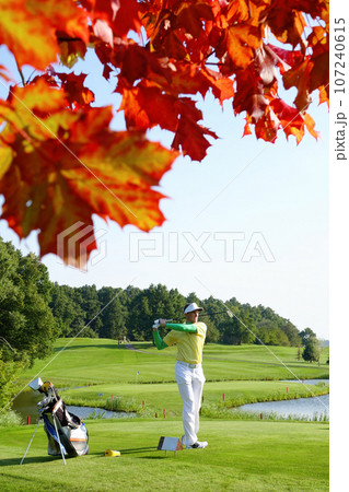 Man playing golf during colorful autumn Man playing golf during colorful autumn 107240615