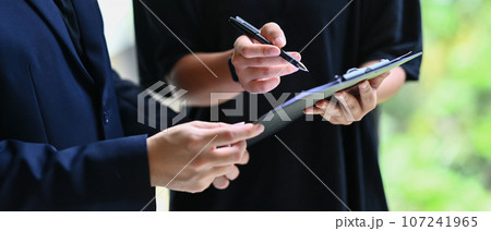 Businesspeople analyzing the results, reviewing project with colleagues in modern office Businesspeople analyzing the results, reviewing project with colleagues in modern office 107241965