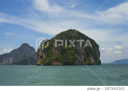 Seascape with green island against blue sky, Phuket, Thailand 107243201
