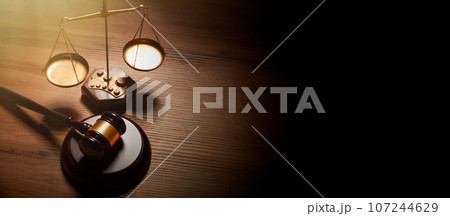Wooden gave and scale, justice and law concept 107244629