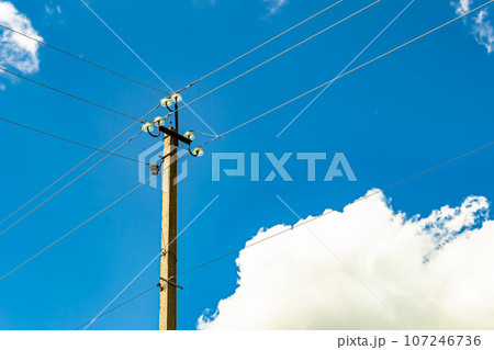 Power electric pole with line wire on colored background close up Power electric pole with line wire on colored background close up 107246736