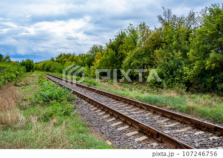 Photography to theme railway track after passing train on railroad Photography to theme railway track after passing train on railroad 107246756