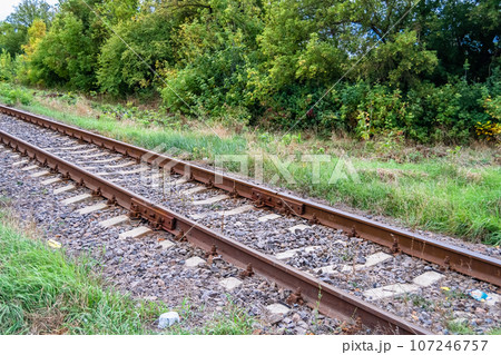 Photography to theme railway track after passing train on railroad 107246757