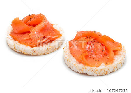 Rice Cake Sandwiches with Fresh Salmon Slices Isolated on White Rice Cake Sandwiches with Fresh Salmon Slices Isolated on White 107247255