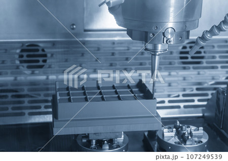 The CNC milling machine cutting the graphite electrode parts. The CNC milling machine cutting the graphite electrode parts. 107249539
