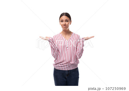 young business lady with a ponytail hairstyle is dressed in a striped blouse on a white background young business lady with a ponytail hairstyle is dressed in a striped blouse on a white background 107250969