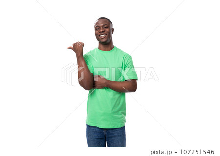 young confident american male promoter wearing green t-shirt with mockup young confident american male promoter wearing green t-shirt with mockup 107251546