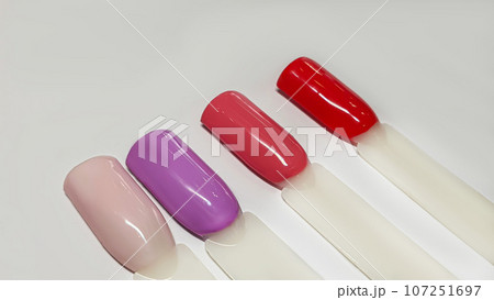 Palette of multi-colored nail polishes. Manicure and gel polish color choice. 107251697