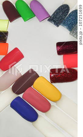 Palette of multi-colored nail polishes. Manicure and gel polish color choice. 107251699