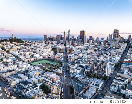 Aerial view of urban borough and downtown with high rise office skyscrapers in background. San Francisco, California, USA Aerial view of urban borough and downtown with high rise office skyscrapers in background. San Francisco, California, USA 107251880