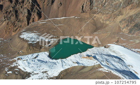 A mountain lake with emerald water is like mirror A mountain lake with emerald water is like mirror 107254795