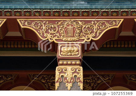 fragment of the facade of a Buddhist datsan Gunzechoinei building with traditional elements fragment of the facade of a Buddhist datsan Gunzechoinei building with traditional elements 107255369