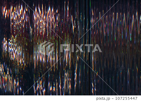 Glitch distortion. Vhs noise. Abstract pattern. Black background with blue yellow red green zigzag lines interference analog TV texture. 107255447