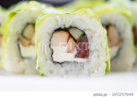 Japanese food restaurant, sushi maki gunkan roll plate or platter set. Sushi set and composition Japanese food restaurant, sushi maki gunkan roll plate or platter set. Sushi set and composition 107257040