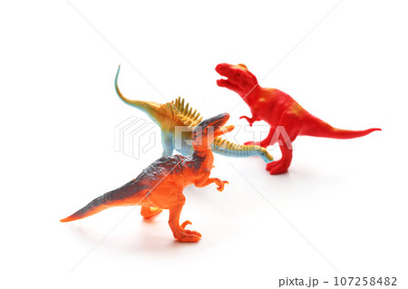 Plastic dinosaur toys on white background. Top view Plastic dinosaur toys on white background. Top view 107258482