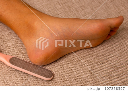 Foot with foot file, Cleansing the heel Foot with foot file, Cleansing the heel 107258597