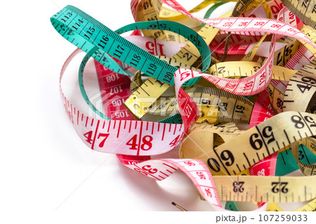 Measuring tapes on white background. Measuring tapes on white background. 107259033