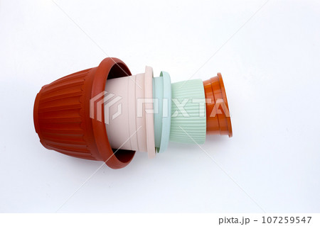 Plastic plant pots, containers on white background. Plastic plant pots, containers on white background. 107259547
