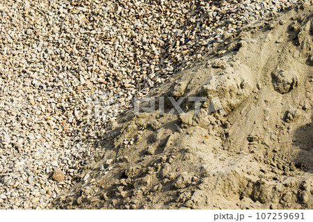 Sand and gravel. View from above. Construction material. Background. Sand and gravel. View from above. Construction material. Background. 107259691