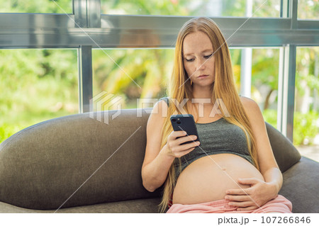 A pregnant woman receives concerning blood test results, her face reflecting worry and concern about her and her baby's health A pregnant woman receives concerning blood test results, her face reflecting worry and concern about her and her baby's health 107266846