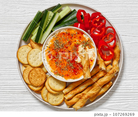 Hot Pepper Jelly Cheese Dip with crackers, veggies 107269269