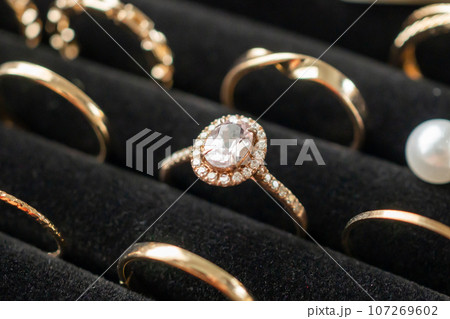 Gold jewelry diamond rings show in luxury retail store display showcase 107269602