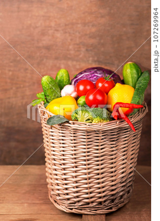 Healthy Organic Vegetables on a Wooden Background 107269964