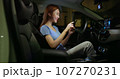 businesswoman use smartphone in car 107270231