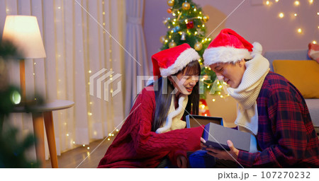 couple exchange xmas gifts box 107270232