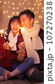 couple play sparkler together 107270238