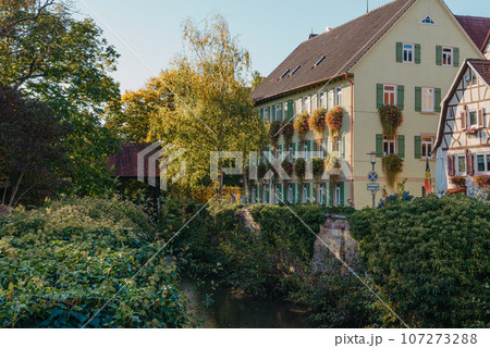 Old national German town house in Bietigheim-Bissingen, Baden-Wuerttemberg, Germany, Europe. Old Town is full of colorful and well preserved buildings. Old national German town house in Bietigheim-Bissingen, Baden-Wuerttemberg, Germany, Europe. Old Town is full of colorful and well preserved buildings. 107273288